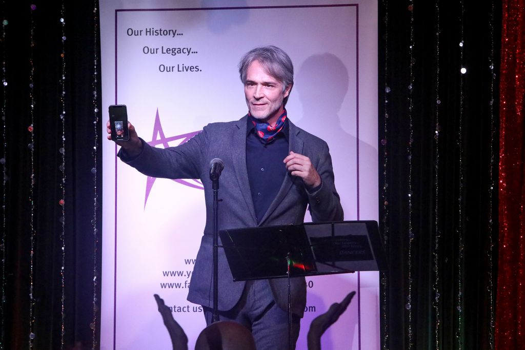 Michael Bunch accepting the award on behalf of Gene Foote, and WhatsApping him into the room for him to watch the warm applause at his award.